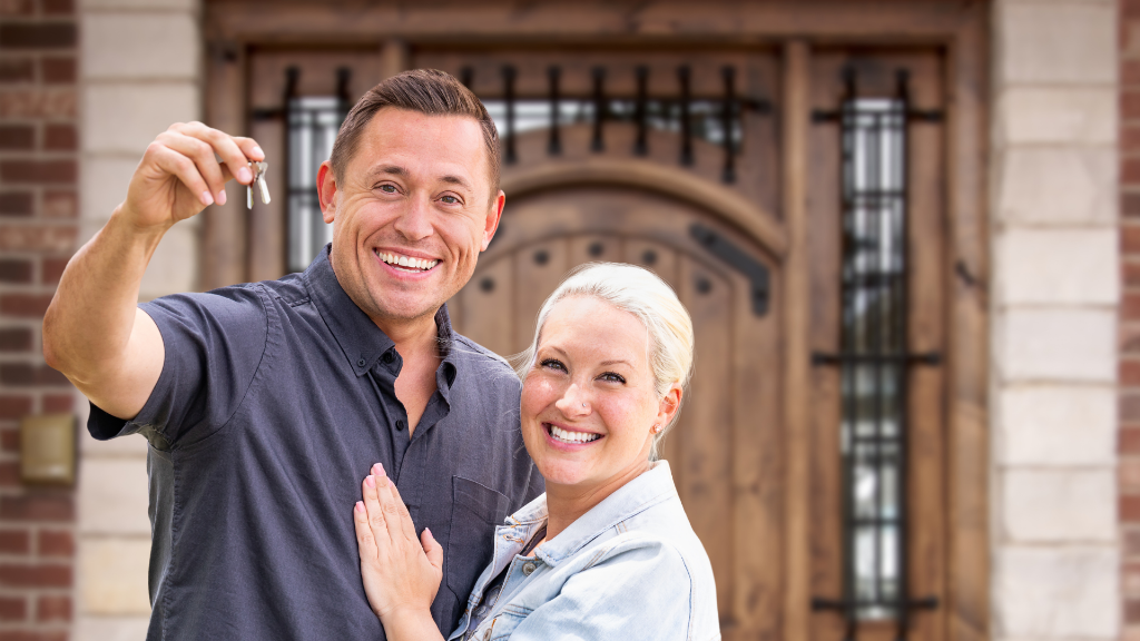Happy Homeowners with Keys - Mortgage Solutions in Alabama